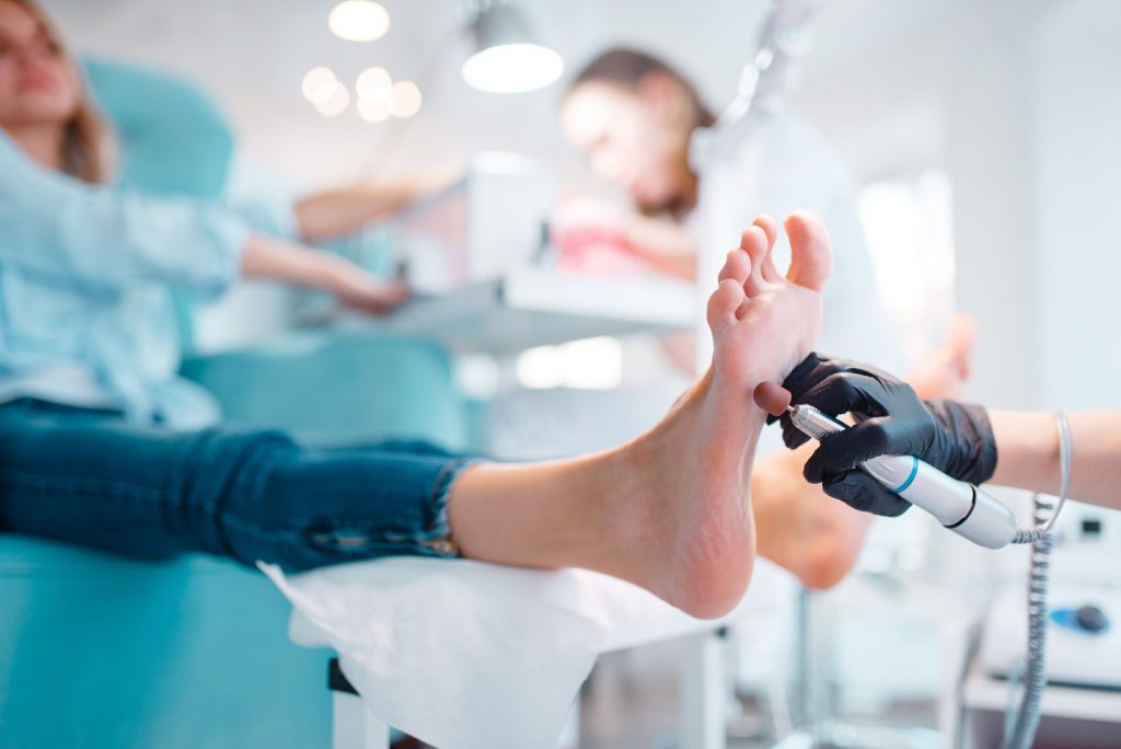 Beautician salon, foot polish procedure